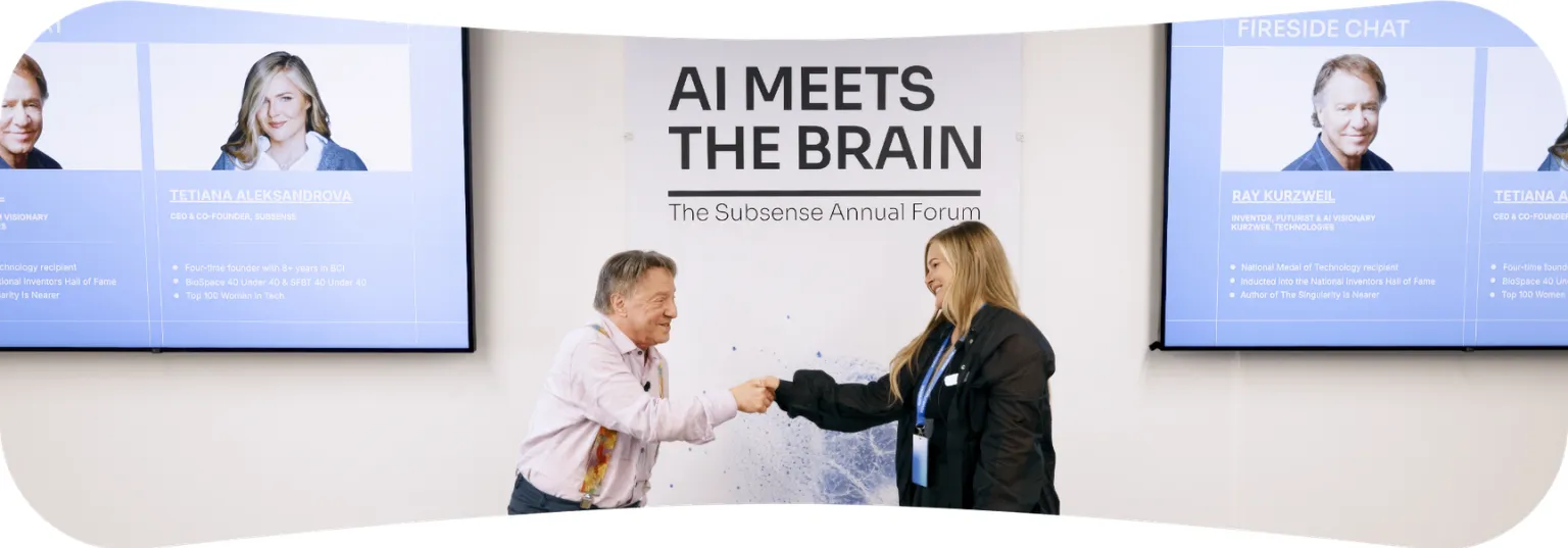 Ray Kurzweil shakes hands with Subsense founder Tetiana Aleksandrova at the Subsense Annual Forum